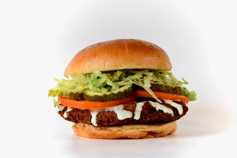 Photo of Crispy Chicken Sandwich - A Delicious All White Meat Chicken Breast, Breaded and Fried in 100% Avocado Oil, served with Lettuce, Tomato and Pickles all loaded onto a soft Toasted Brioche Bun. Don't forget to choose your Dressing!!!