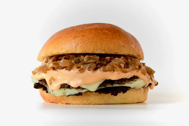 Photo of Impossible Crispy Burger - Try our Double Smashed Plant Based (Impossible Burger), served with White American Cheese, Grilled Onions, and House Sauce (Thousand Island) all served on a soft Toasted Brioche Bun.